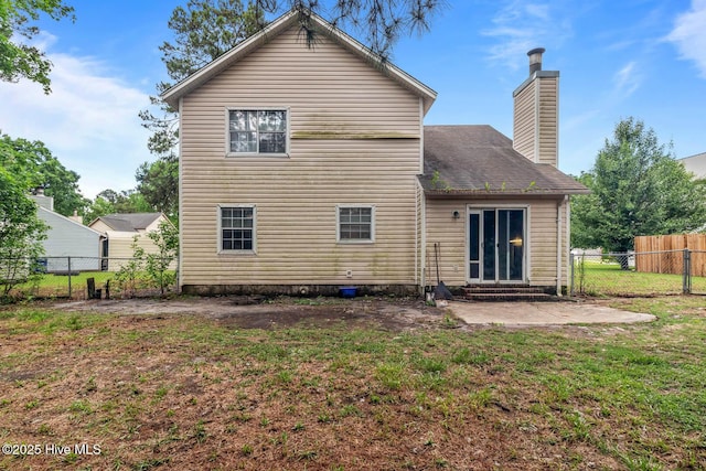 213 Spruce Ct, Jacksonville, NC 28546 - back of property featuring entry steps, a chimney, and a patio