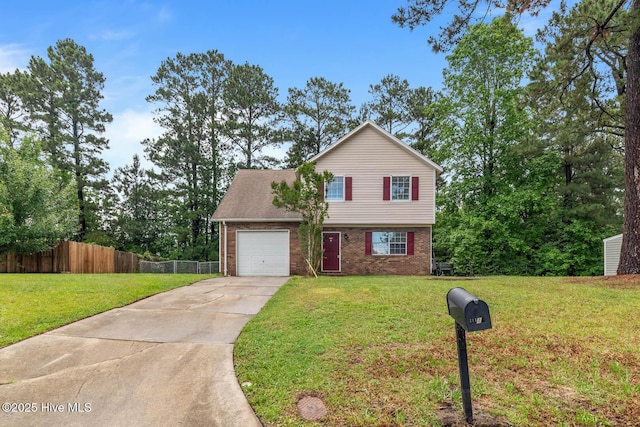 213 Spruce Ct, Jacksonville, NC 28546 - view of front facade featuring concrete driveway, a garage, brick siding, and a shingled roof