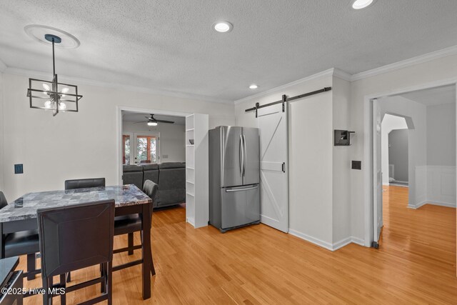 kitchen featuring open shelves, ornamental molding, dark countertops, a sink, and stainless steel appliances