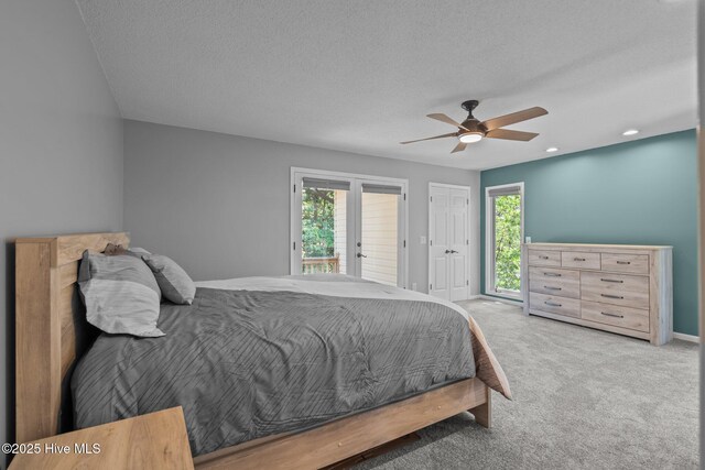unfurnished bedroom with baseboards, carpet flooring, a textured ceiling, and a ceiling fan