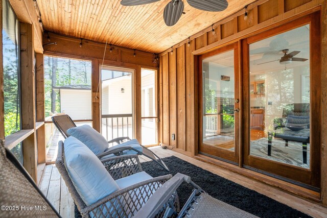 sunroom / solarium with ceiling fan and a wealth of natural light