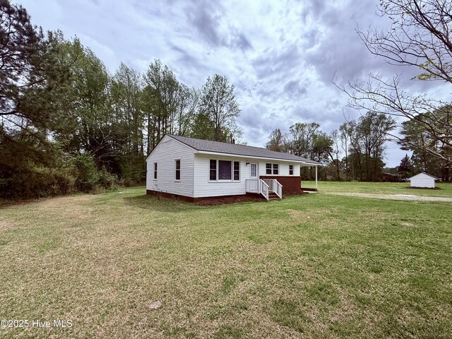 view of front of property with crawl space and a front yard