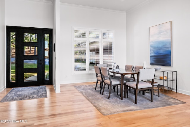 120 Clay Cir W, End, NC 27376 - dining area with baseboards, wood finished floors, a wealth of natural light, and ornamental molding