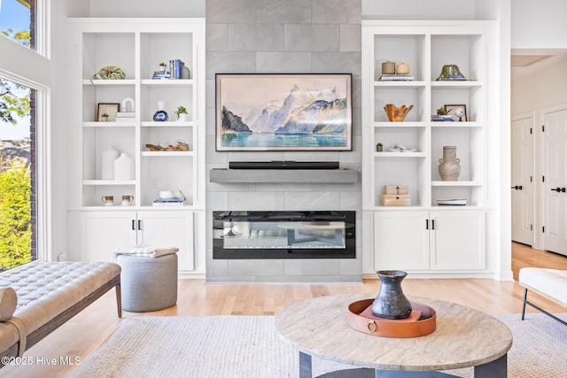 120 Clay Cir W, End, NC 27376 - living room featuring a tile fireplace and light wood finished floors