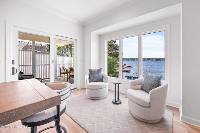 120 Clay Cir W, End, NC 27376 - living area featuring light wood-style flooring, a wealth of natural light, crown molding, and a water view