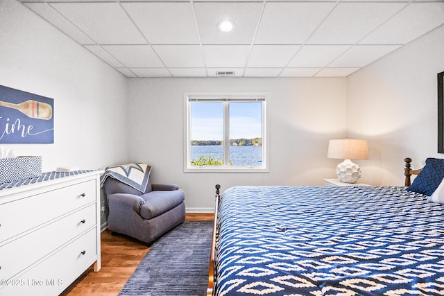 120 Clay Cir W, End, NC 27376 - bedroom featuring baseboards, wood finished floors, visible vents, and a drop ceiling