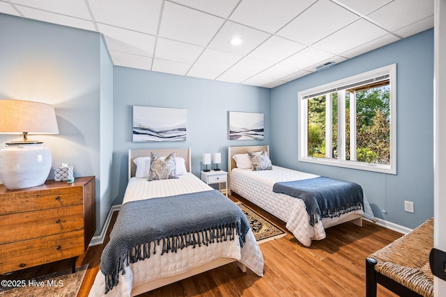 120 Clay Cir W, End, NC 27376 - bedroom with wood finished floors, visible vents, and a drop ceiling
