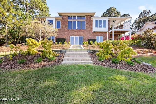 120 Clay Cir W, End, NC 27376 - rear view of house featuring brick siding, a yard, french doors, and a balcony