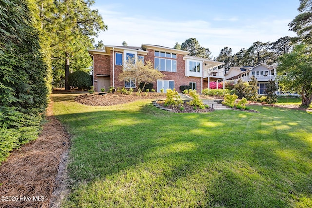 120 Clay Cir W, End, NC 27376 - back of house with a lawn and brick siding