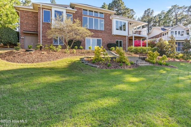 120 Clay Cir W, End, NC 27376 - back of house featuring brick siding, a yard, and a balcony