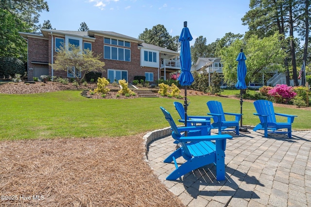 120 Clay Cir W, End, NC 27376 - exterior space with a yard, brick siding, and a patio area
