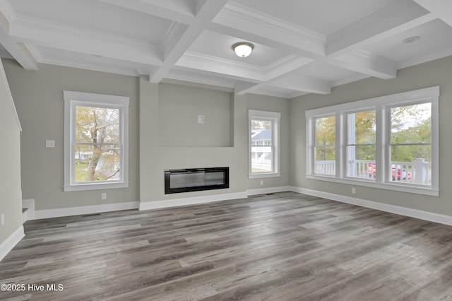 101 SE 68th St, Oak Island, NC 28465 - unfurnished living room with coffered ceiling, wood finished floors, and beam ceiling