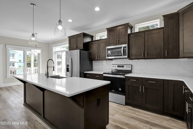 101 SE 68th St, Oak Island, NC 28465 - kitchen featuring light countertops, tasteful backsplash, appliances with stainless steel finishes, and a sink