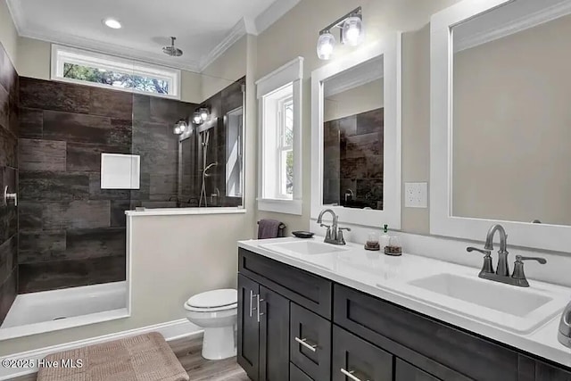 101 SE 68th St, Oak Island, NC 28465 - full bathroom with wood finished floors, a sink, ornamental molding, and walk in shower