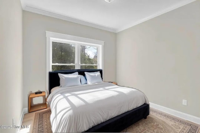 101 SE 68th St, Oak Island, NC 28465 - bedroom with ornamental molding, baseboards, and wood finished floors