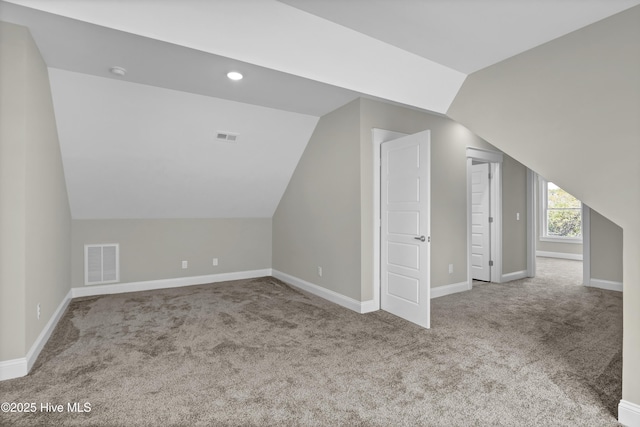 101 SE 68th St, Oak Island, NC 28465 - bonus room with carpet, visible vents, and lofted ceiling