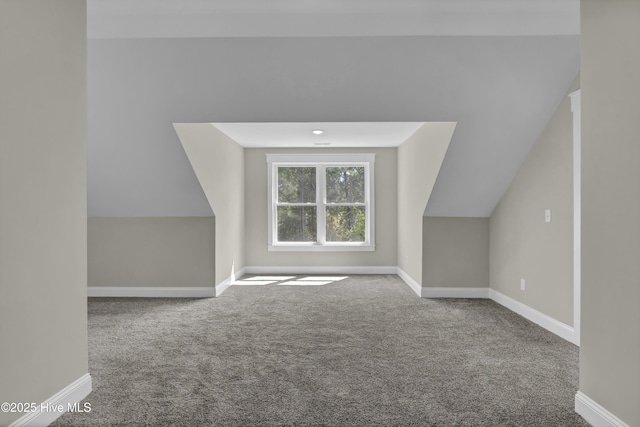 101 SE 68th St, Oak Island, NC 28465 - bonus room with carpet flooring, baseboards, and vaulted ceiling