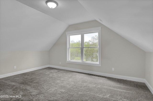 101 SE 68th St, Oak Island, NC 28465 - bonus room featuring baseboards, carpet, and vaulted ceiling