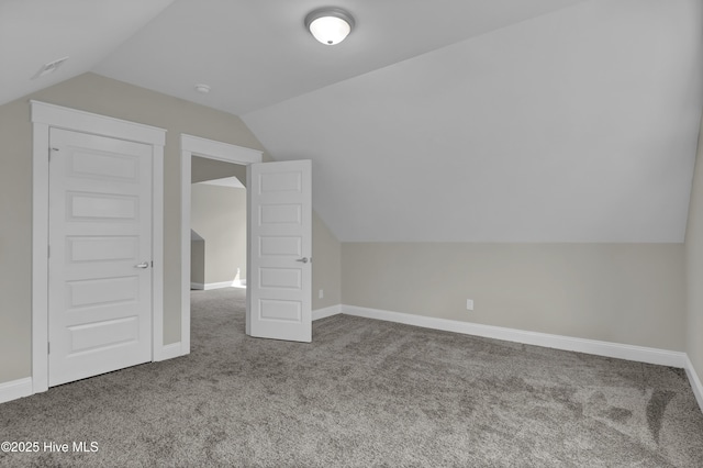 101 SE 68th St, Oak Island, NC 28465 - additional living space featuring baseboards, carpet flooring, and lofted ceiling