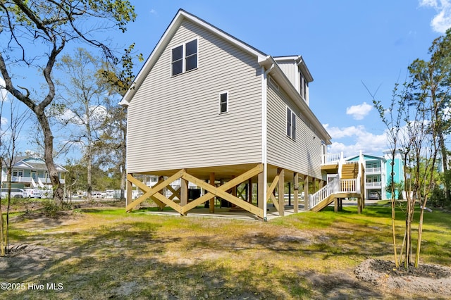 101 SE 68th St, Oak Island, NC 28465 - view of home's exterior featuring stairway