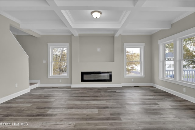 101 SE 68th St, Oak Island, NC 28465 - unfurnished living room featuring a glass covered fireplace, wood finished floors, beamed ceiling, and coffered ceiling