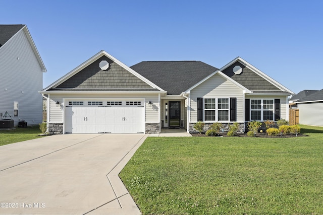 craftsman-style house featuring an attached garage, driveway, stone siding, and a front lawn