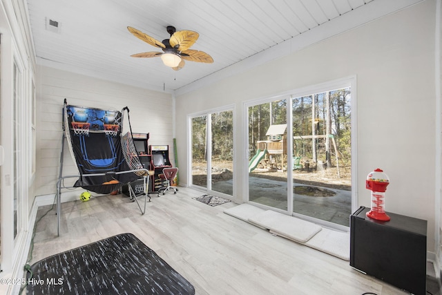 sitting room featuring visible vents, a ceiling fan, and wood finished floors