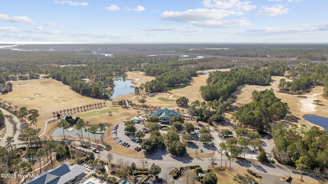 bird's eye view featuring a water view, a view of trees, and golf course view