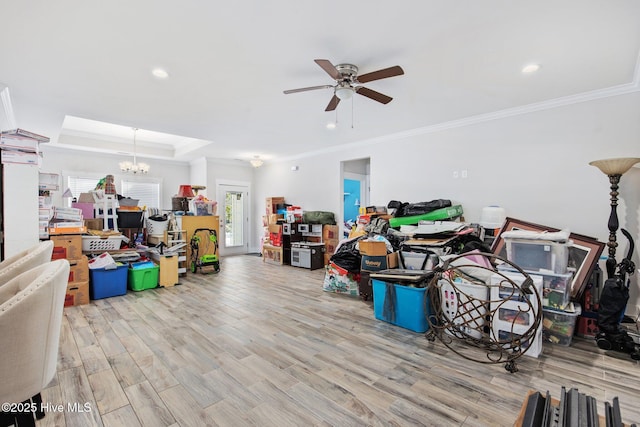 interior space with crown molding, ceiling fan with notable chandelier, recessed lighting, and wood finished floors