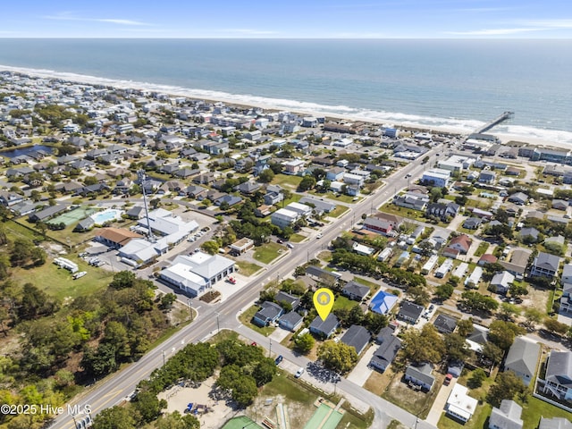 drone / aerial view with a beach view and a water view