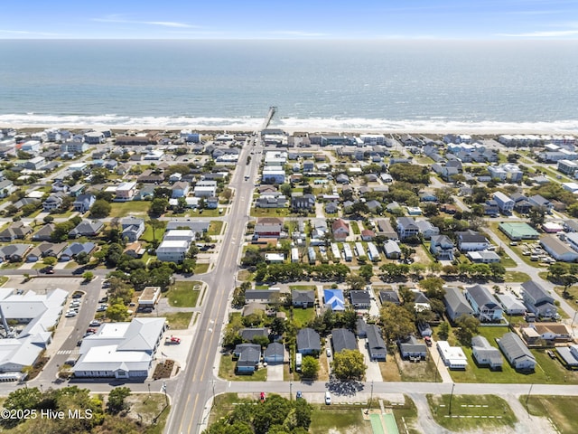 birds eye view of property featuring a view of the beach, a residential view, and a water view