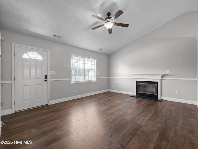 unfurnished living room featuring dark wood-type flooring, a ceiling fan, and vaulted ceiling
