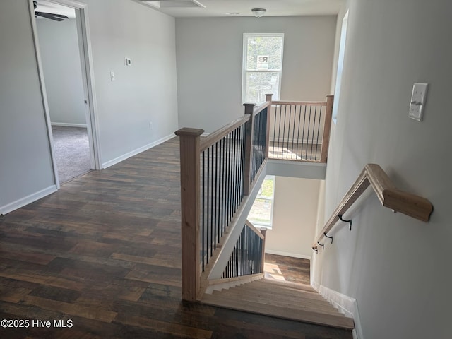 stairs with baseboards and wood finished floors