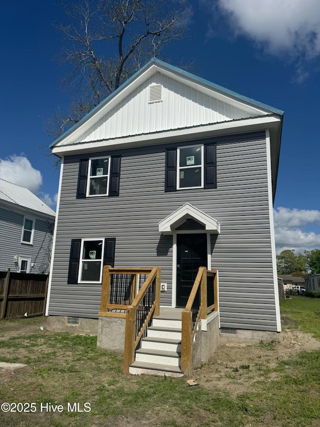 view of front of home with fence