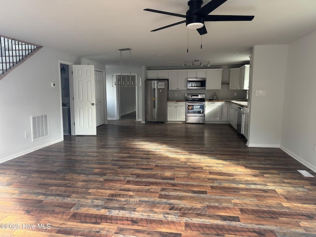 kitchen featuring ceiling fan, dark wood finished floors, visible vents, and stainless steel appliances