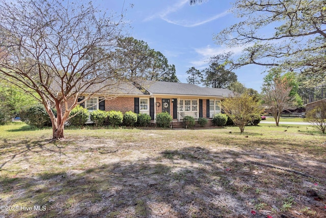 single story home with brick siding