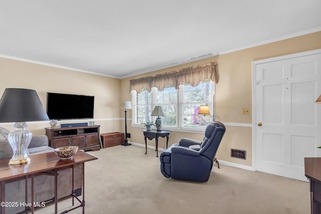 living room featuring baseboards, ornamental molding, and carpet floors