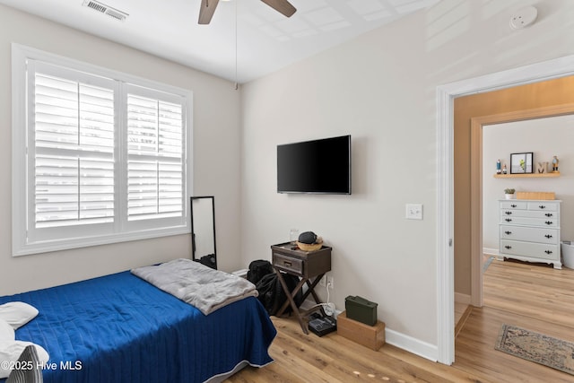 5006 Carleton Dr Unit 90, Wilmington, NC 28403 - bedroom with wood finished floors, baseboards, and ceiling fan