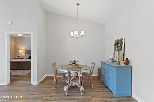 5006 Carleton Dr Unit 90, Wilmington, NC 28403 - dining room with light wood-style floors, a chandelier, baseboards, and high vaulted ceiling