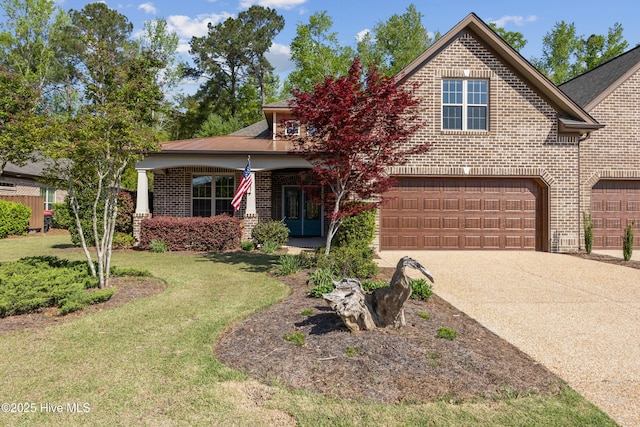 view of front of house featuring a garage, a front yard, brick siding, and concrete driveway