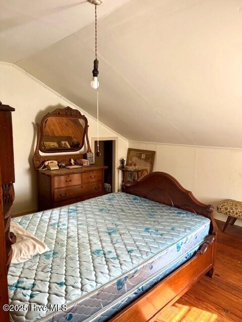 1885 NC-306, Grantsboro, NC 28529 - bedroom featuring lofted ceiling and wood finished floors