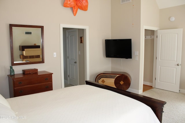 bedroom featuring visible vents, carpet flooring, and baseboards