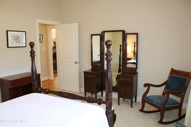bedroom featuring baseboards