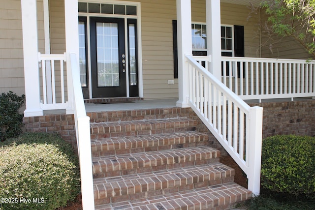 entrance to property featuring covered porch