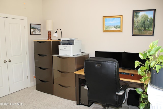 office area featuring speckled floor
