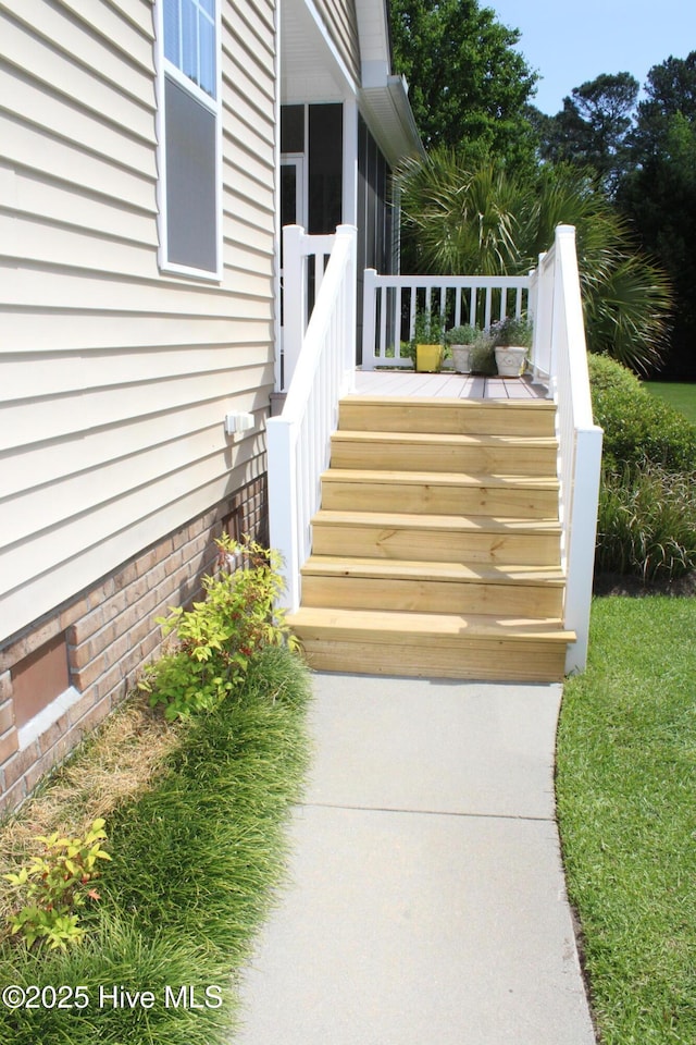 doorway to property featuring a wooden deck