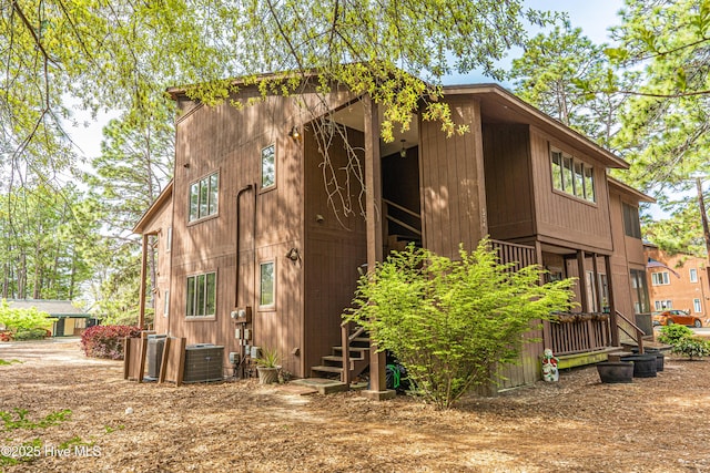 view of home's exterior with central AC unit