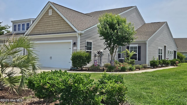 1905 Coleman Lake Dr, Calabash, NC 28467 - view of front of house with roof with shingles, a front yard, and an attached garage