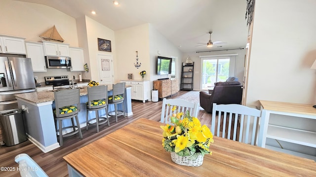 1905 Coleman Lake Dr, Calabash, NC 28467 - dining space with ceiling fan, dark wood-style flooring, high vaulted ceiling, and recessed lighting