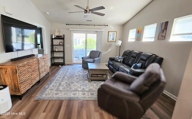 1905 Coleman Lake Dr, Calabash, NC 28467 - living room featuring lofted ceiling, dark wood-style flooring, a ceiling fan, and baseboards